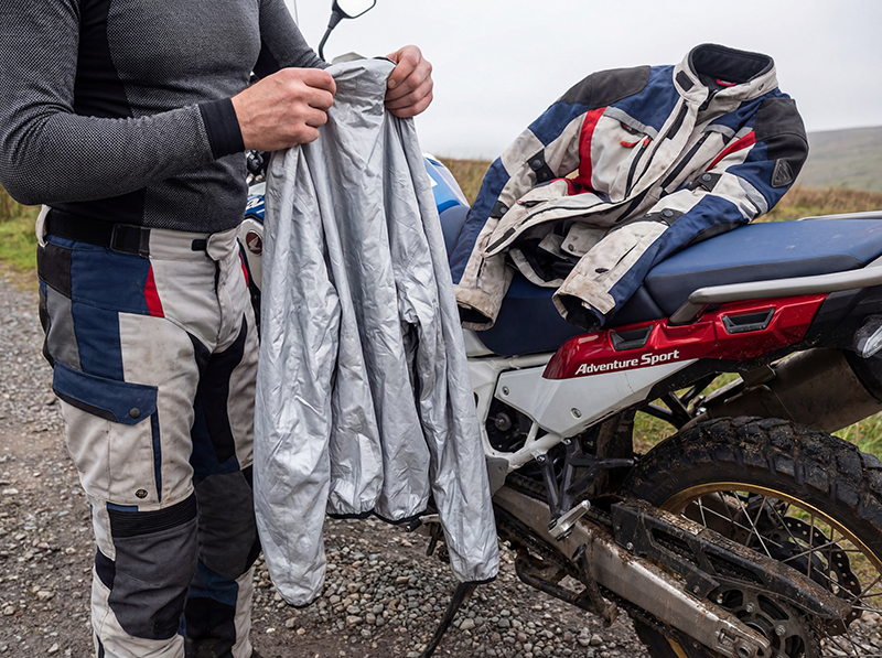 Man holding removable motorcycle jacket membrane